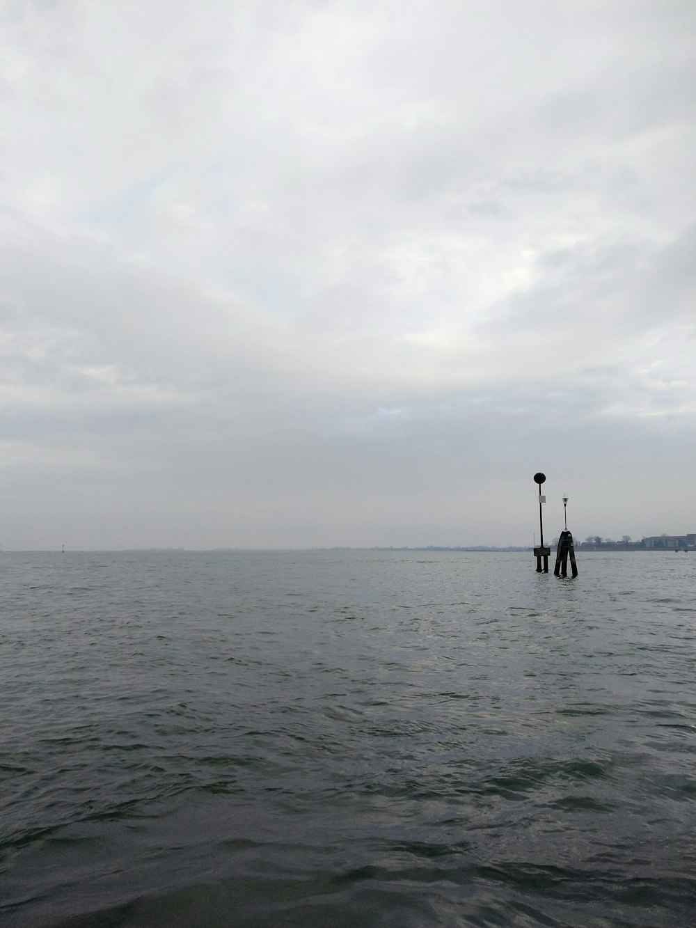 a couple of poles sticking out of the water