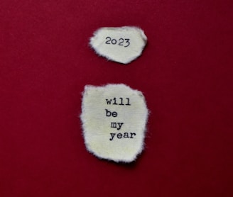 two pieces of torn paper with the words will by year written on them