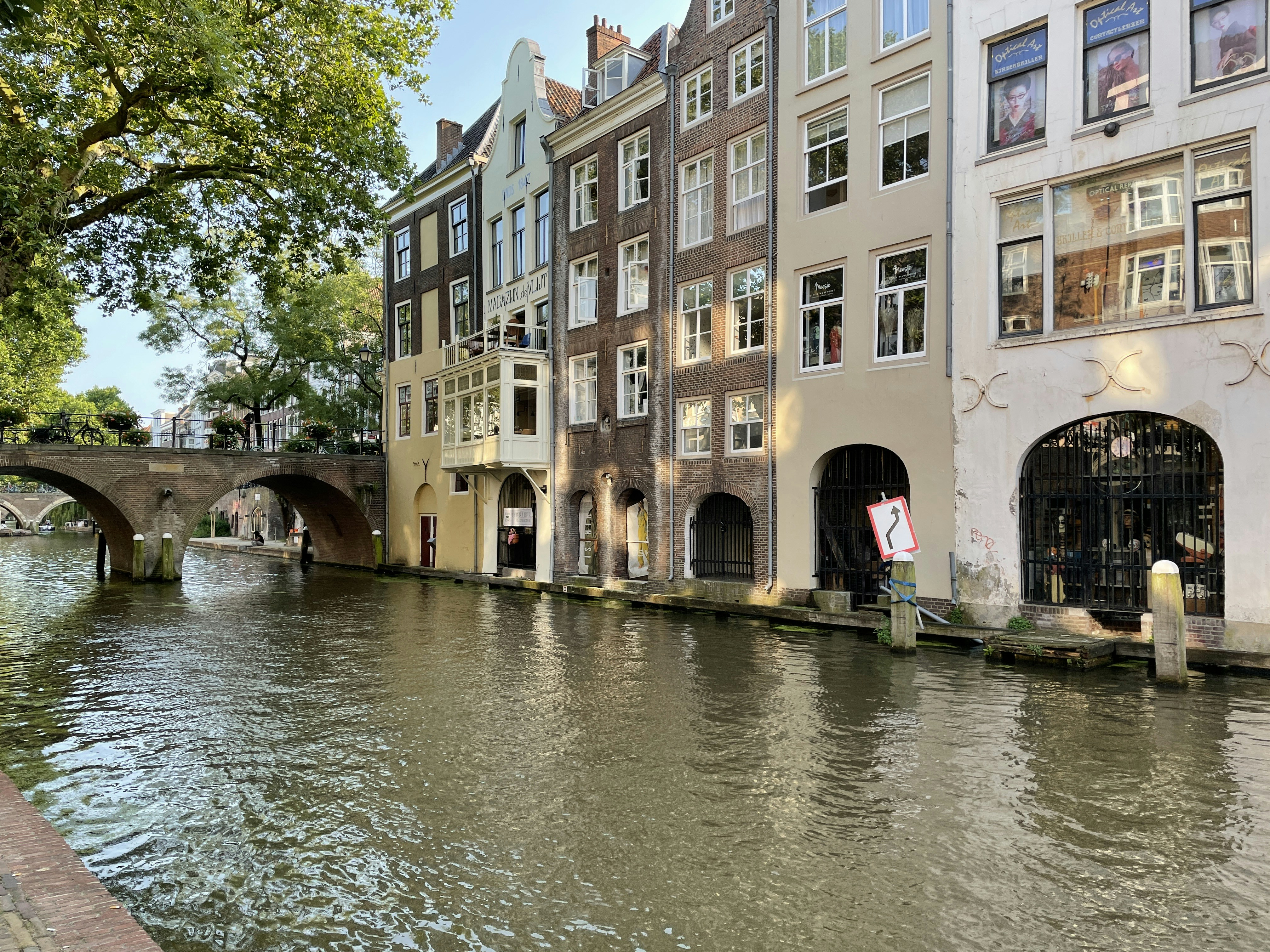 a river running through a city next to tall buildings