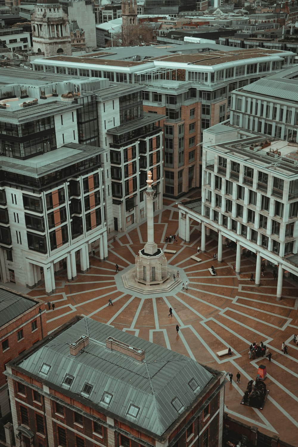 an aerial view of a city with buildings and a clock tower