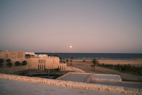 Low buildings along the shore at dusk — Marsa Alam, Egypt