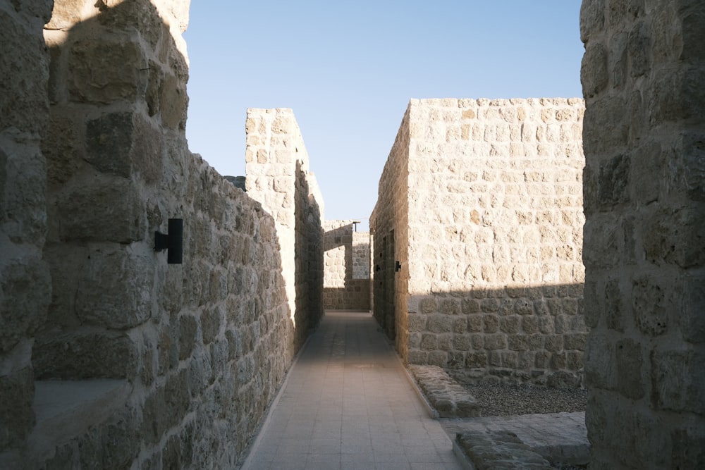 a narrow alley between two stone buildings