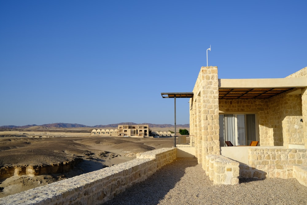 a stone building in the middle of a desert