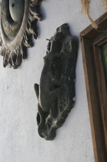 A finished piece hanging on a rustic wall, radiating the unique energy of alchemized art.