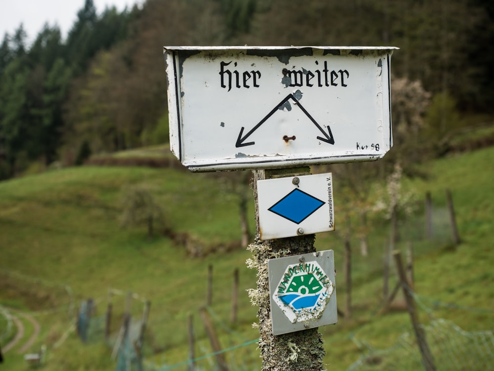 a close up of a street sign on a pole