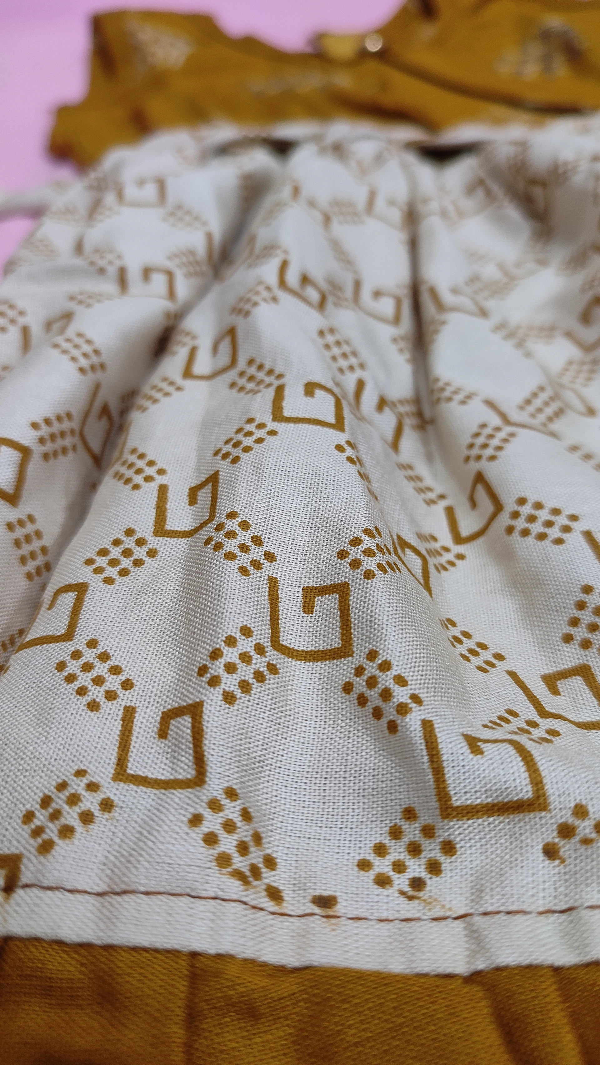 Close-up of a digital patternmaking interface displaying layered garment pieces with precise measurements and annotations.