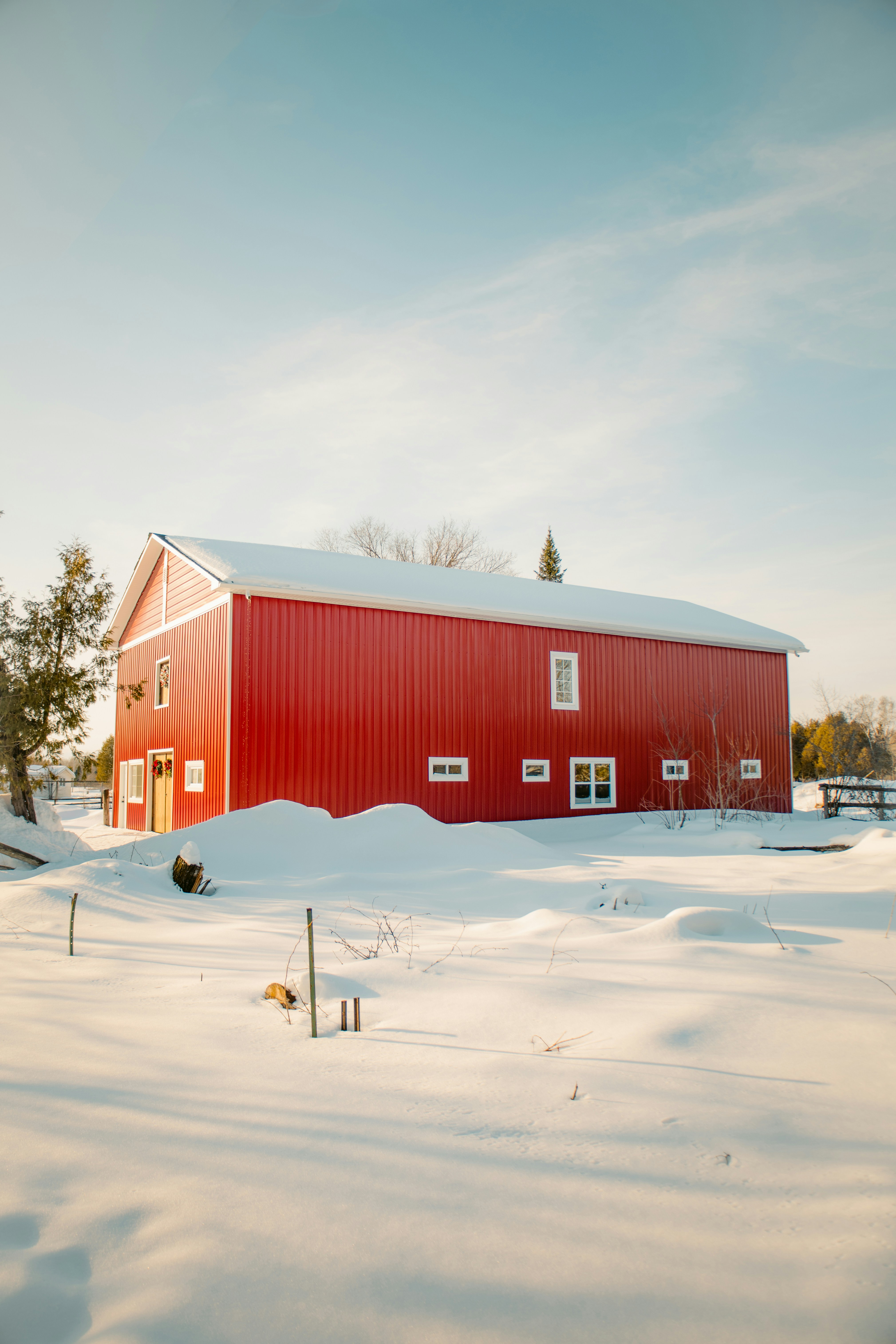 A red barn in the middle of a snowy field photo – Free Ottawa Image on ...