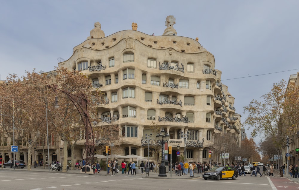 a very tall building sitting on the side of a road