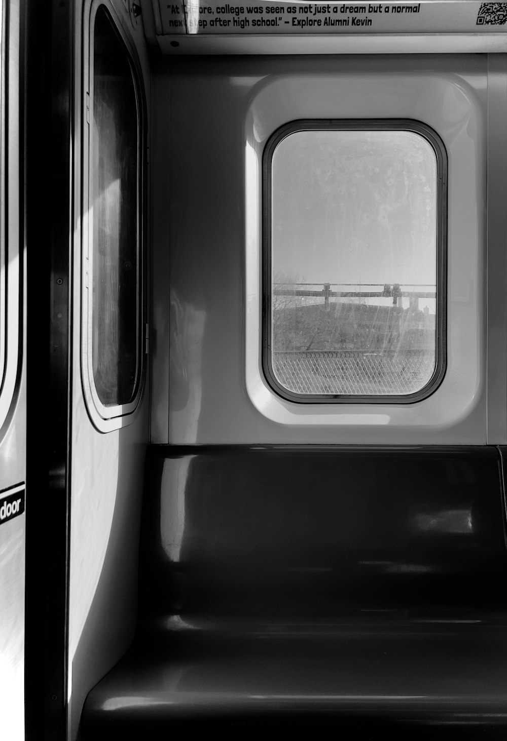 a black and white photo of the inside of a train