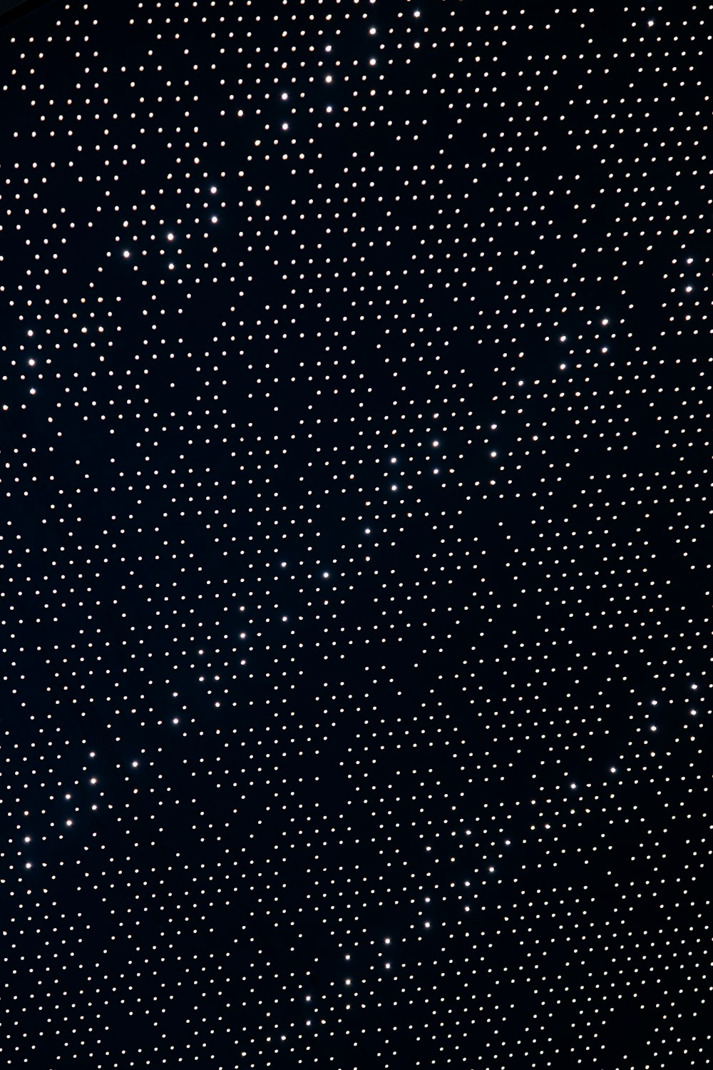 a black and white photo of a sky full of stars