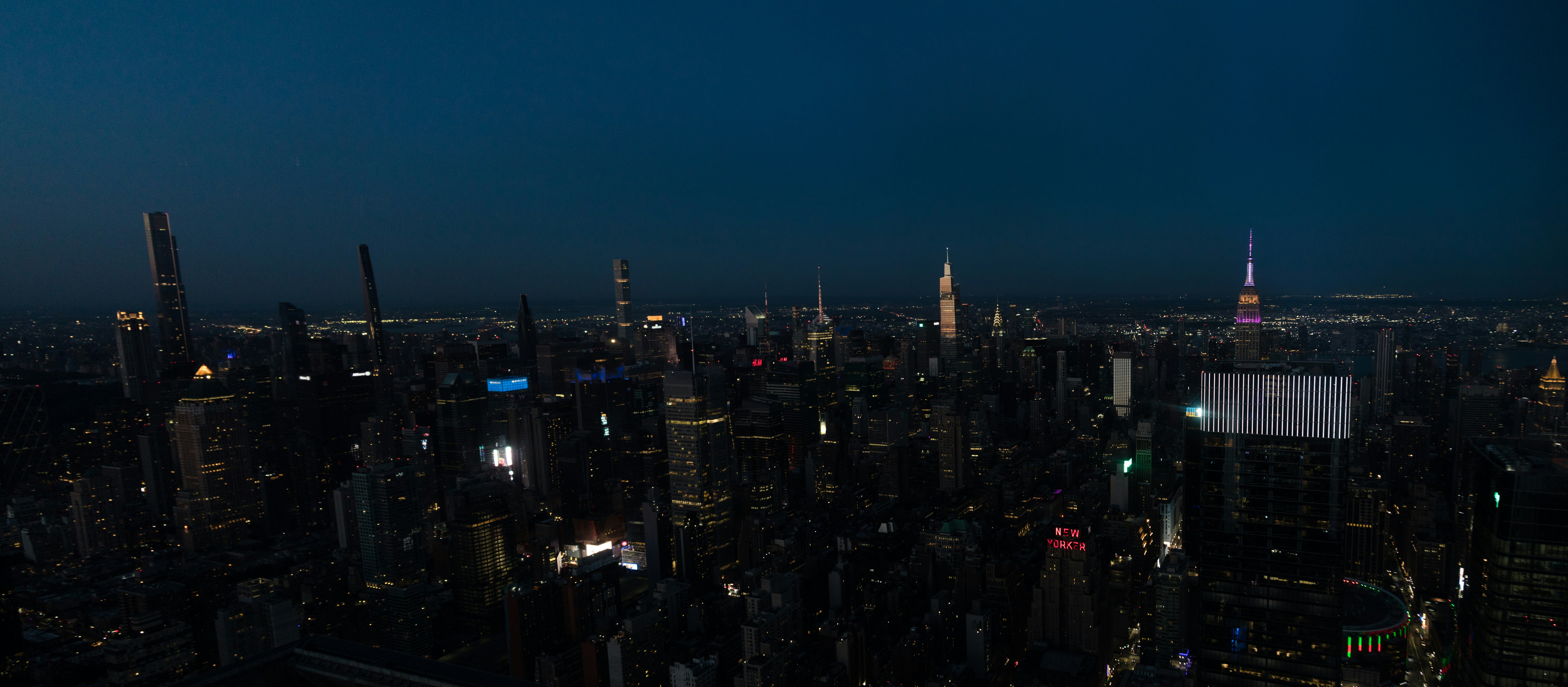 A view of a city at night from the top of a skyscraper photo – Free New ...