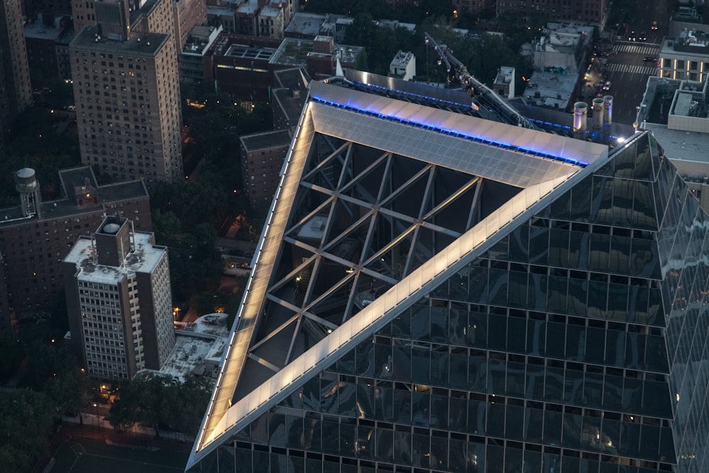a very tall building with a blue light on top of it