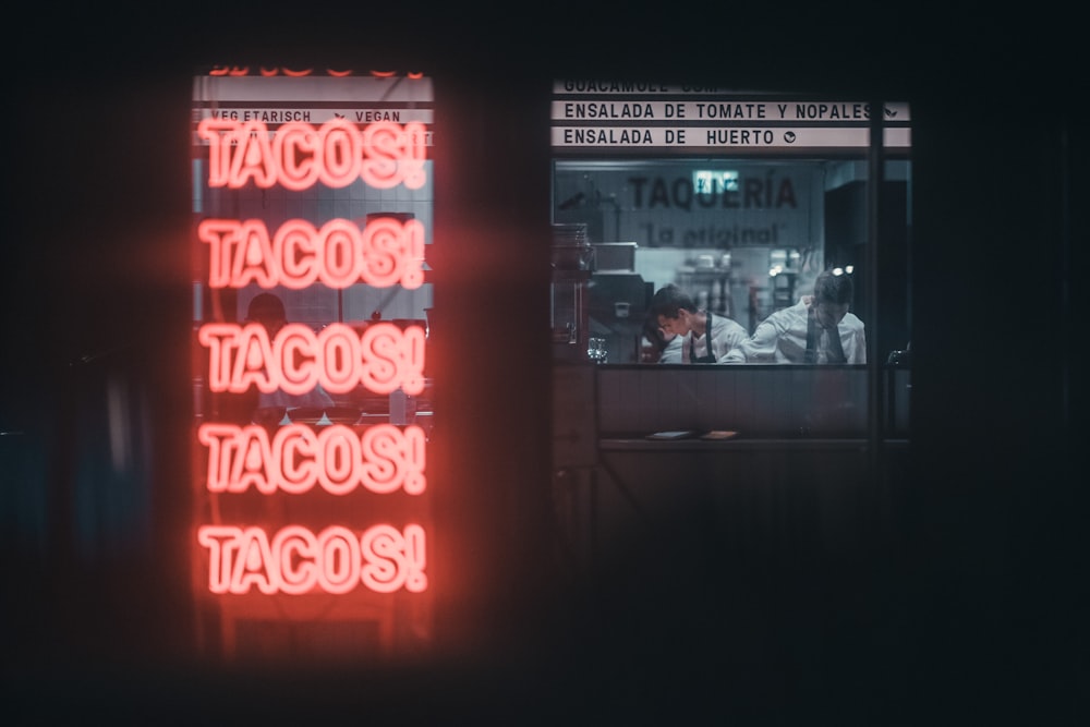 a neon sign that reads tacost tacost tacost tacos