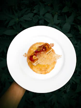 Close-up of a beautifully plated sugar-free dessert with fresh berries on a pastel plate.
