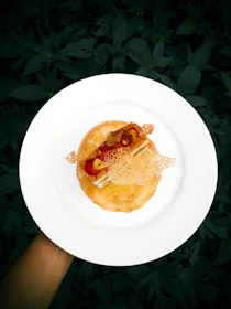 Close-up of a beautifully plated sugar-free dessert with fresh berries on a pastel plate.