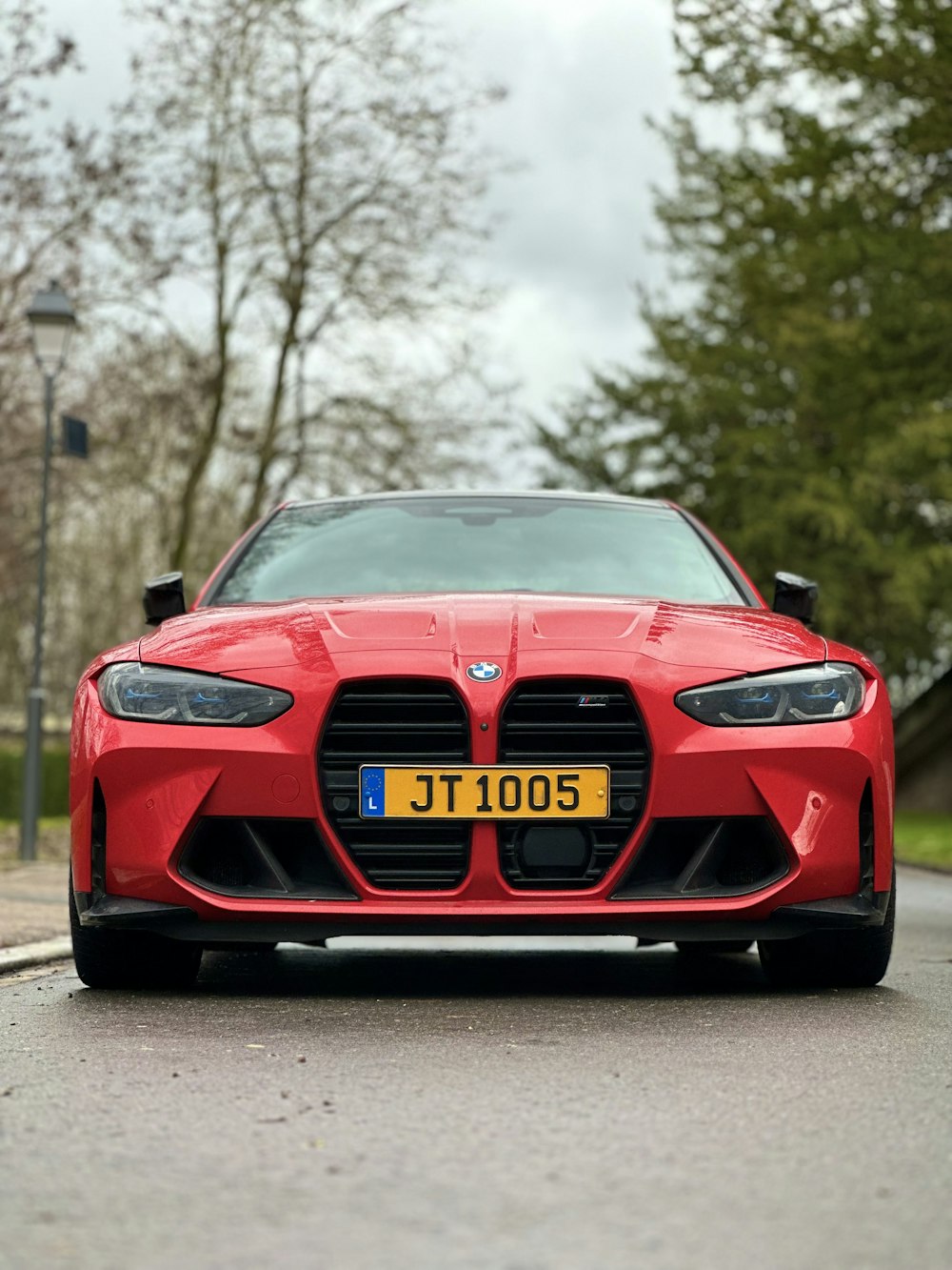 a red sports car parked on the side of the road