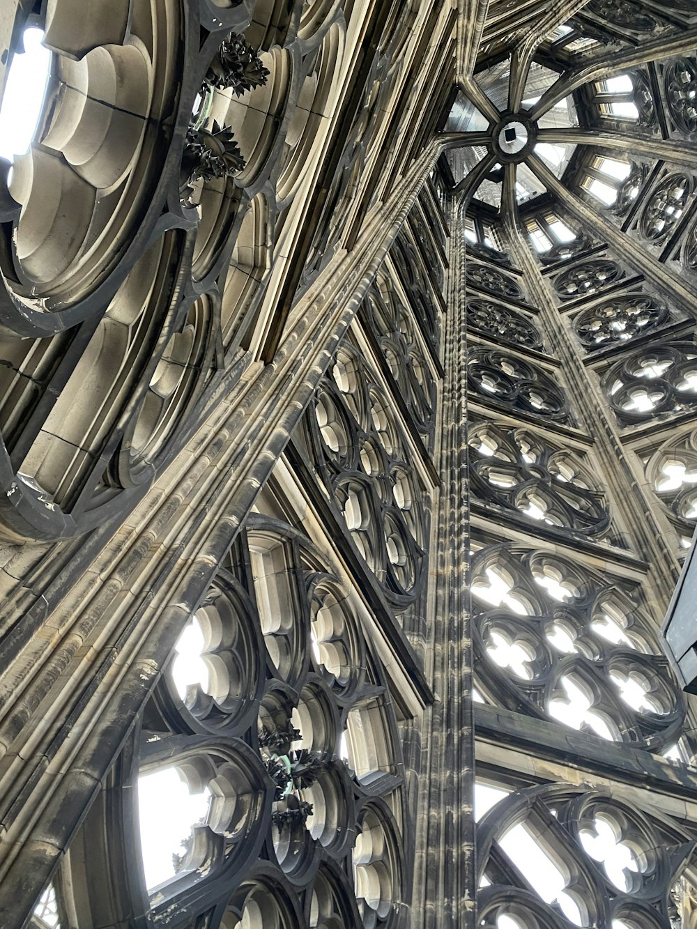 the ceiling of a large cathedral with many windows