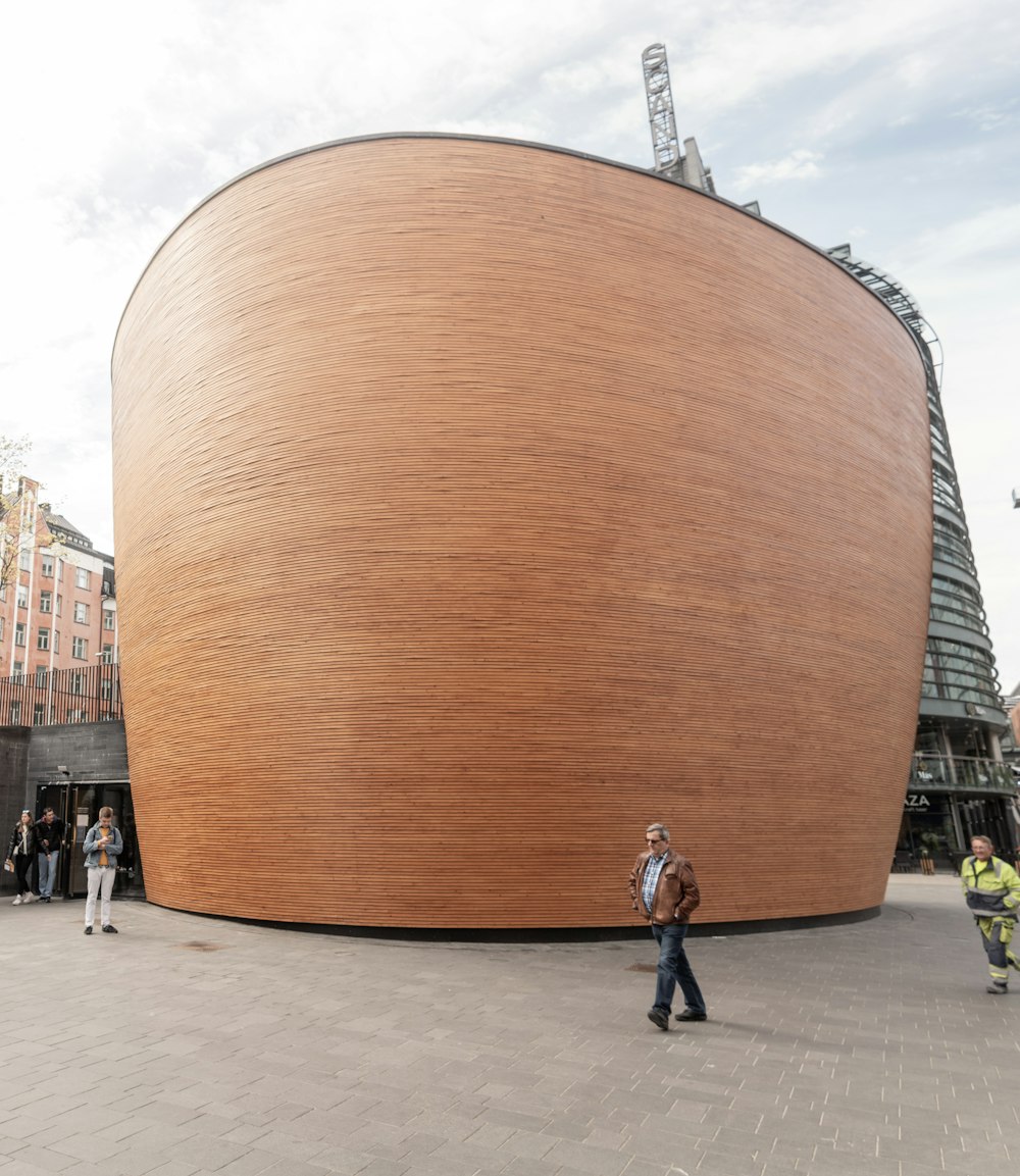 a large wooden structure sitting on top of a sidewalk