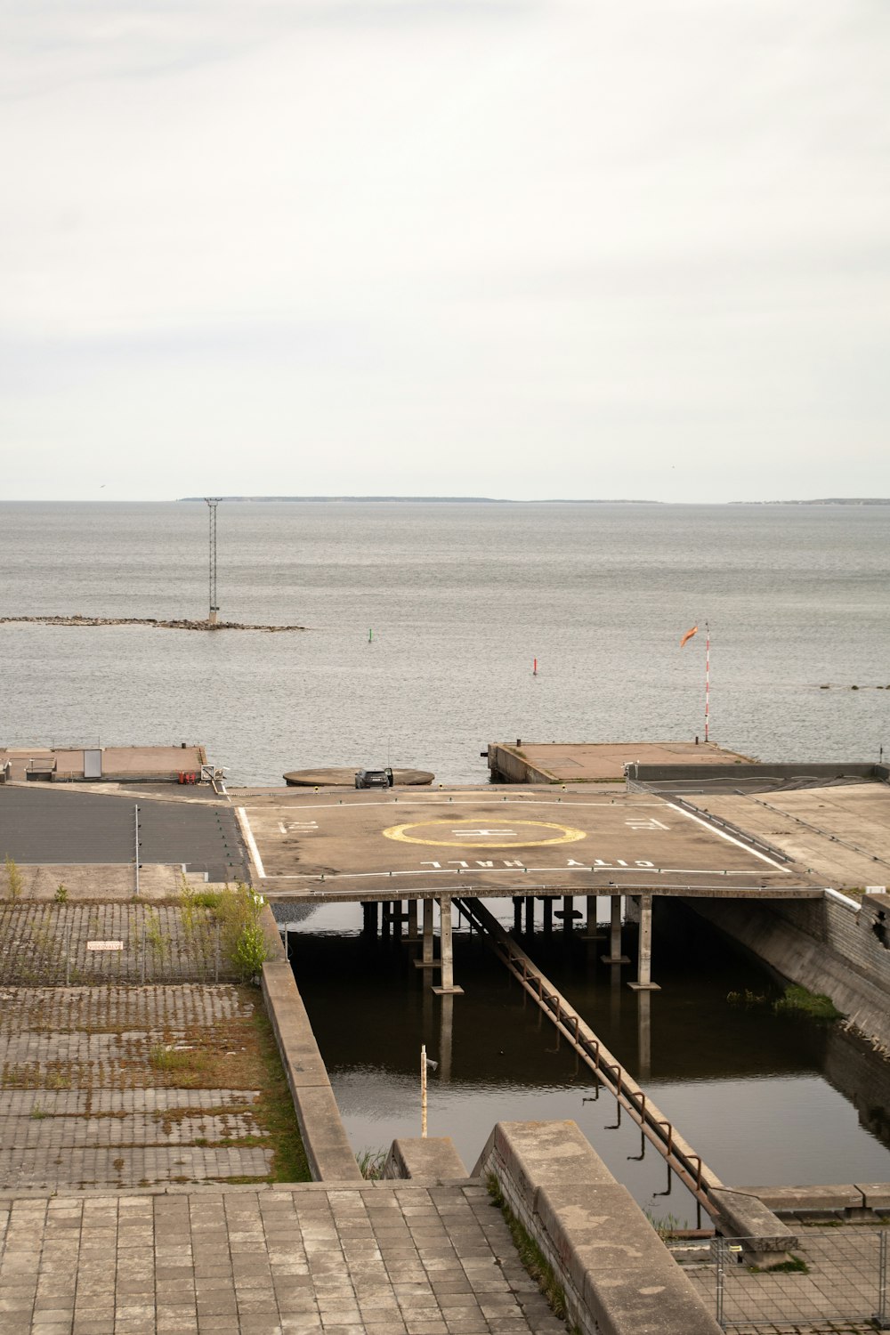 a large body of water sitting next to a pier