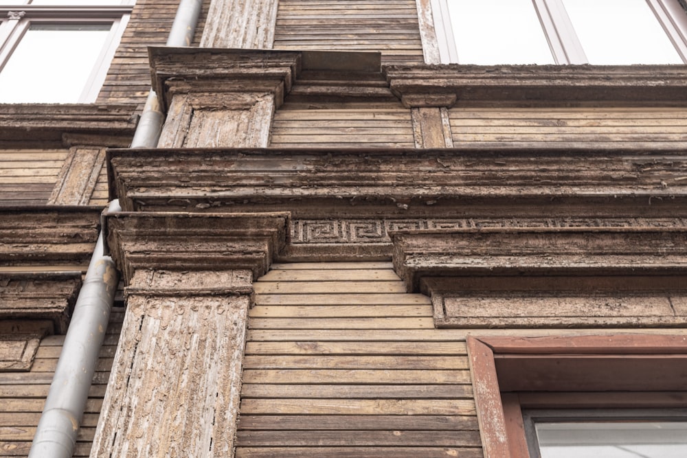 a tall building with wooden trim and windows