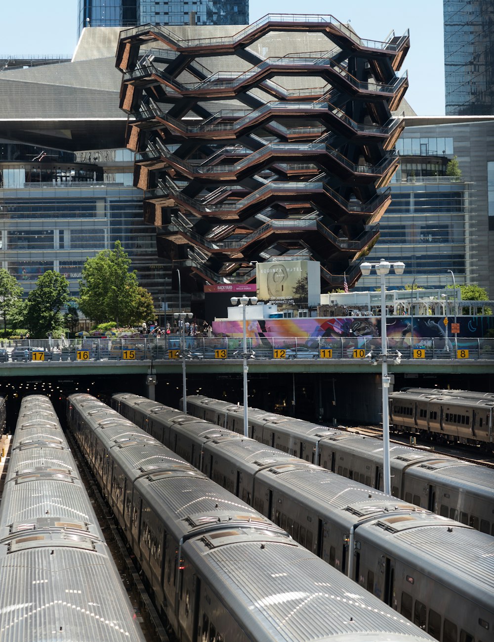 a train station with several trains on the tracks