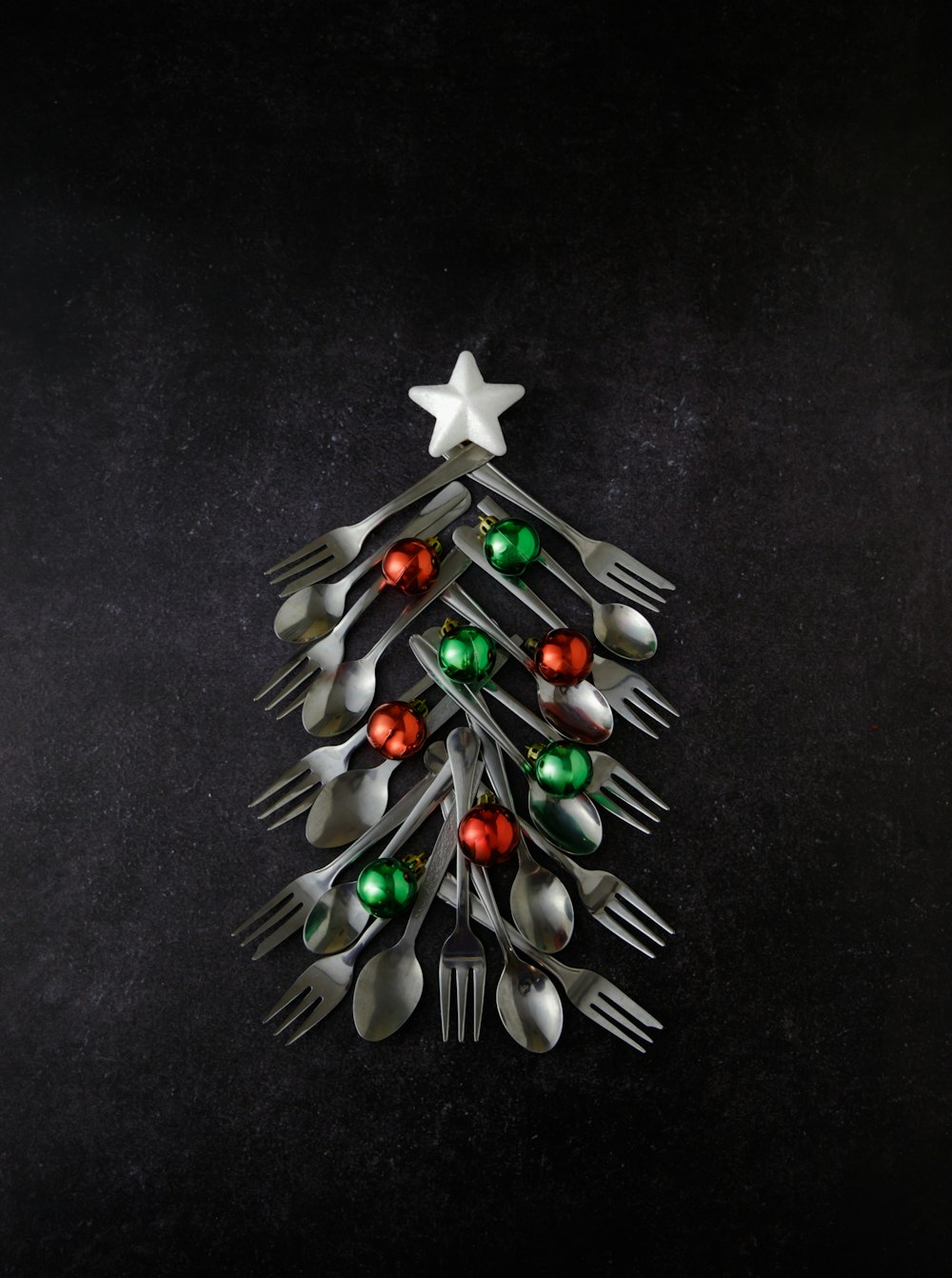 a christmas tree made out of forks and spoons