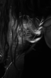 A minimalist black and white image representing transformation and mystery.