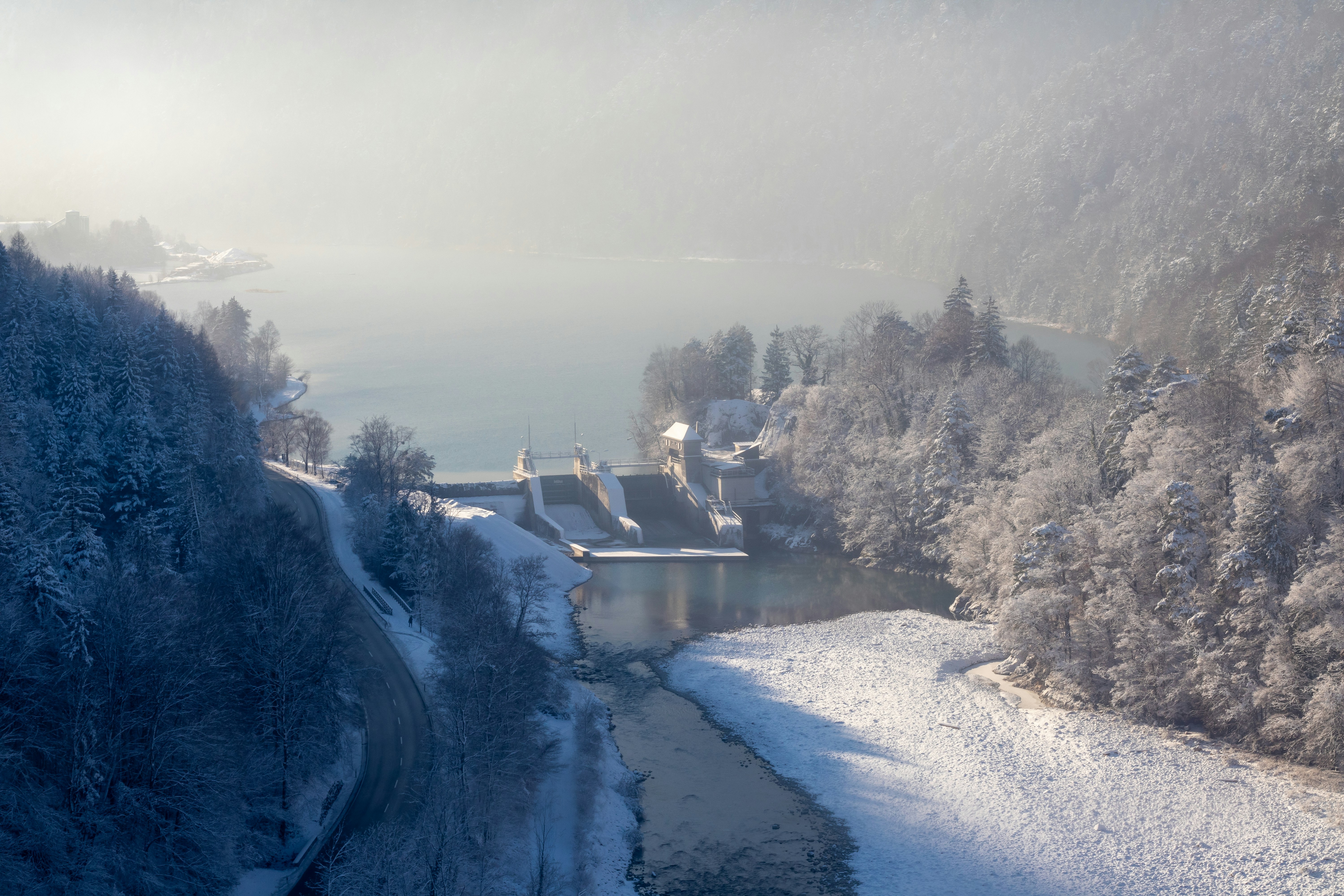 a river running through a snow covered forest