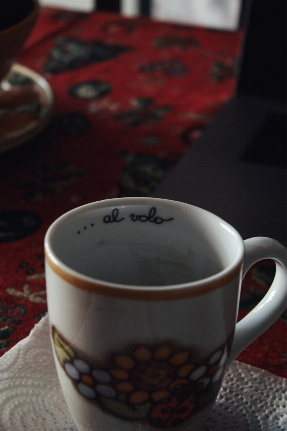 a coffee cup sitting on top of a table