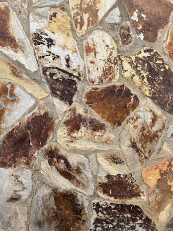A close-up of a beautifully finished stone veneer wall showcasing intricate textures and colors.