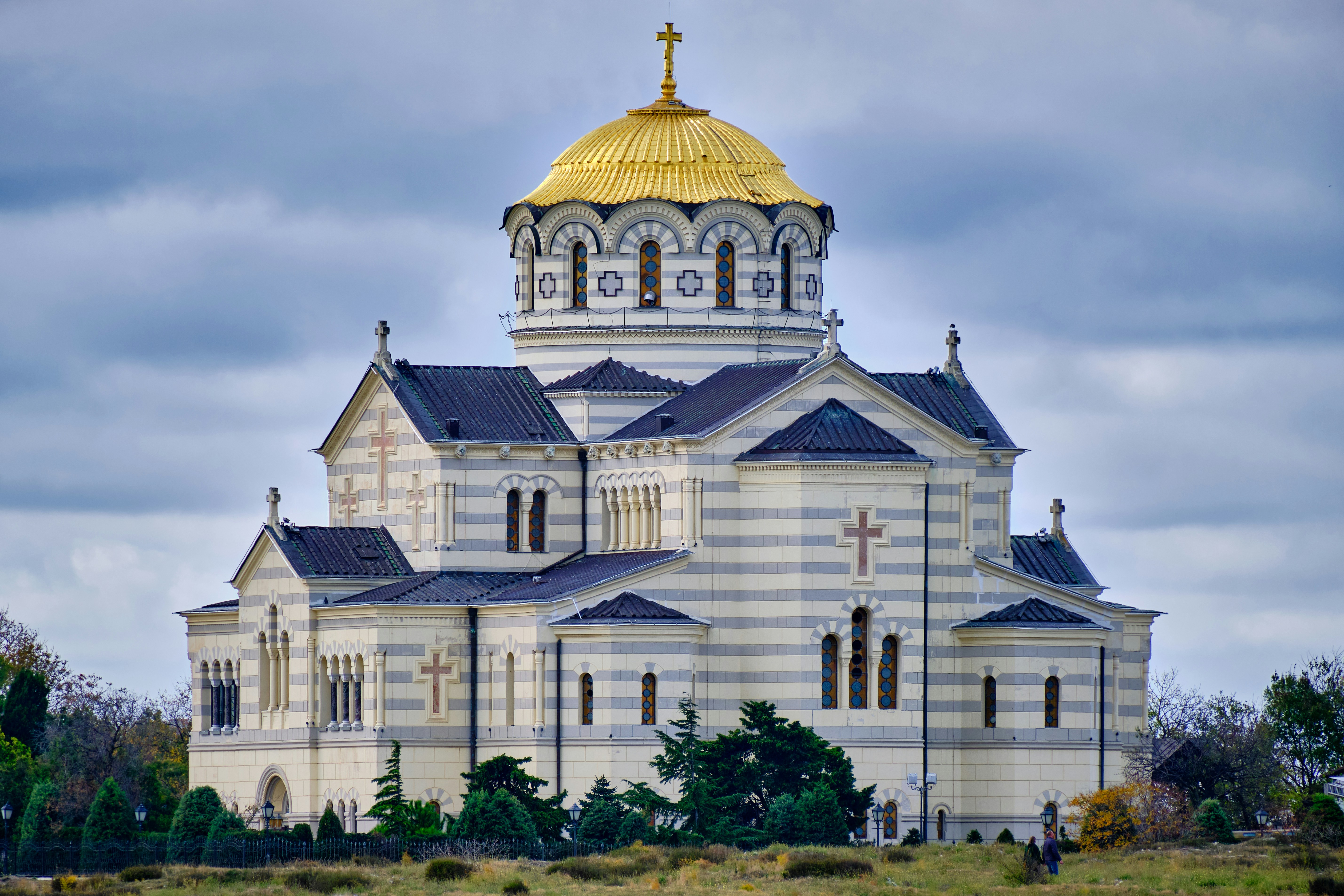 a large white building with a gold dome