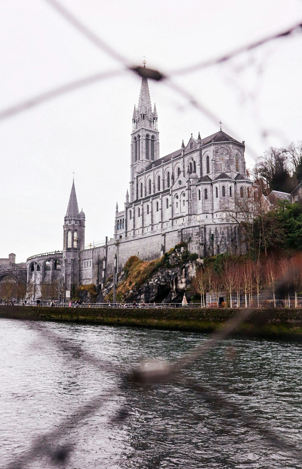 a view of a cathedral from across a river