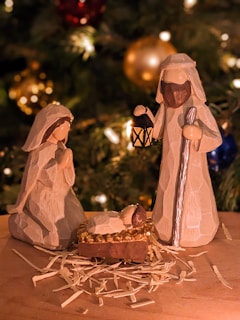 a nativity scene of a manger scene with a baby jesus in a man