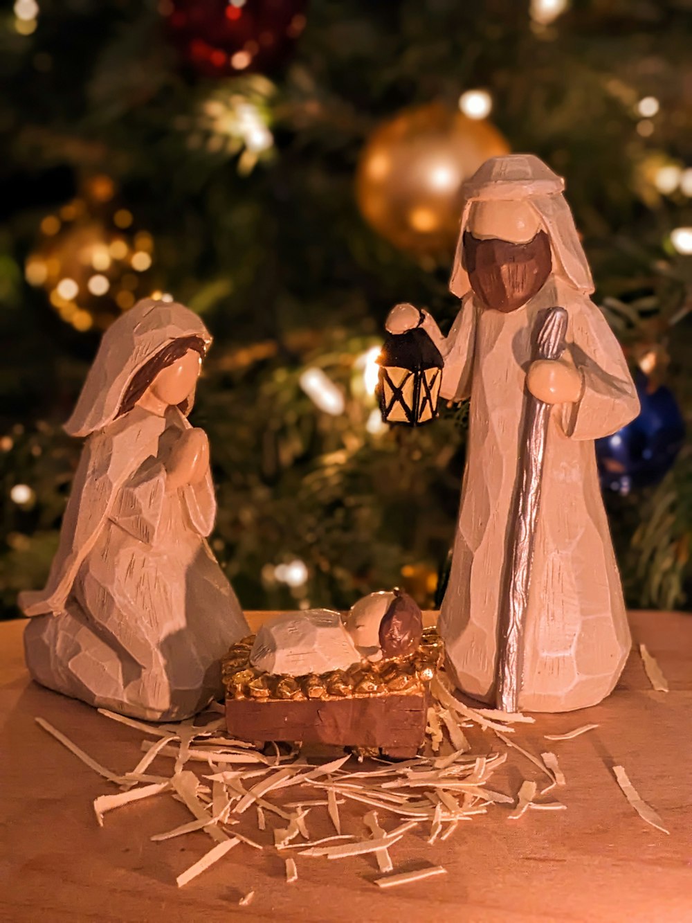 a nativity scene of a manger scene with a baby jesus in a man