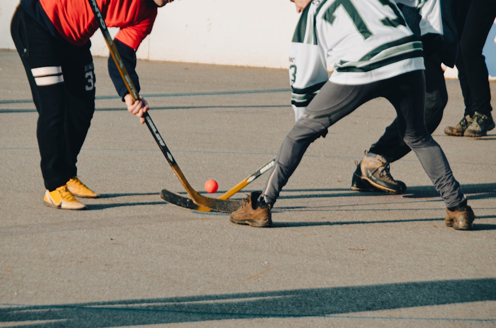 a group of young men playing a game of hockey
