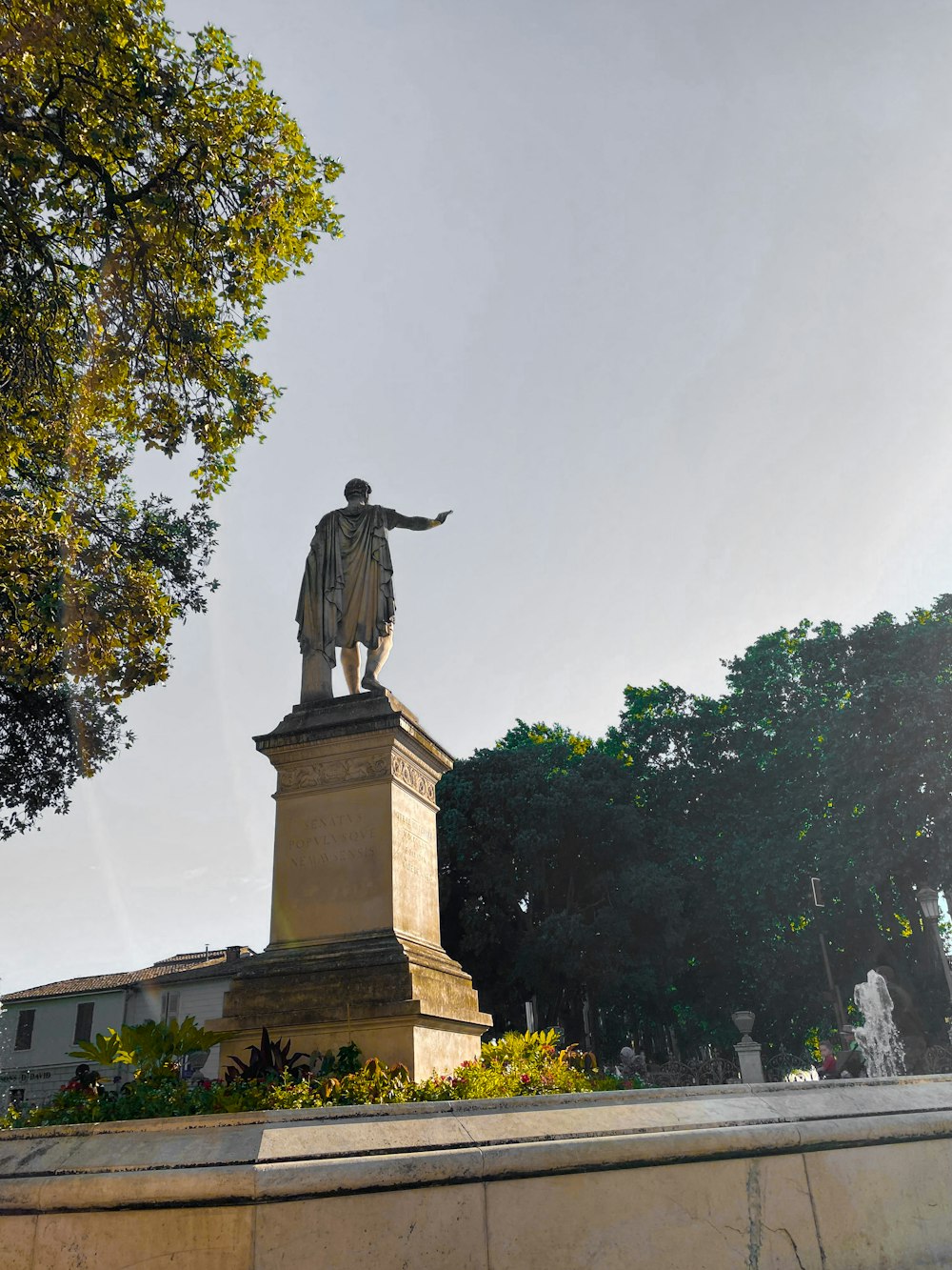 a statue of a man with his arms outstretched