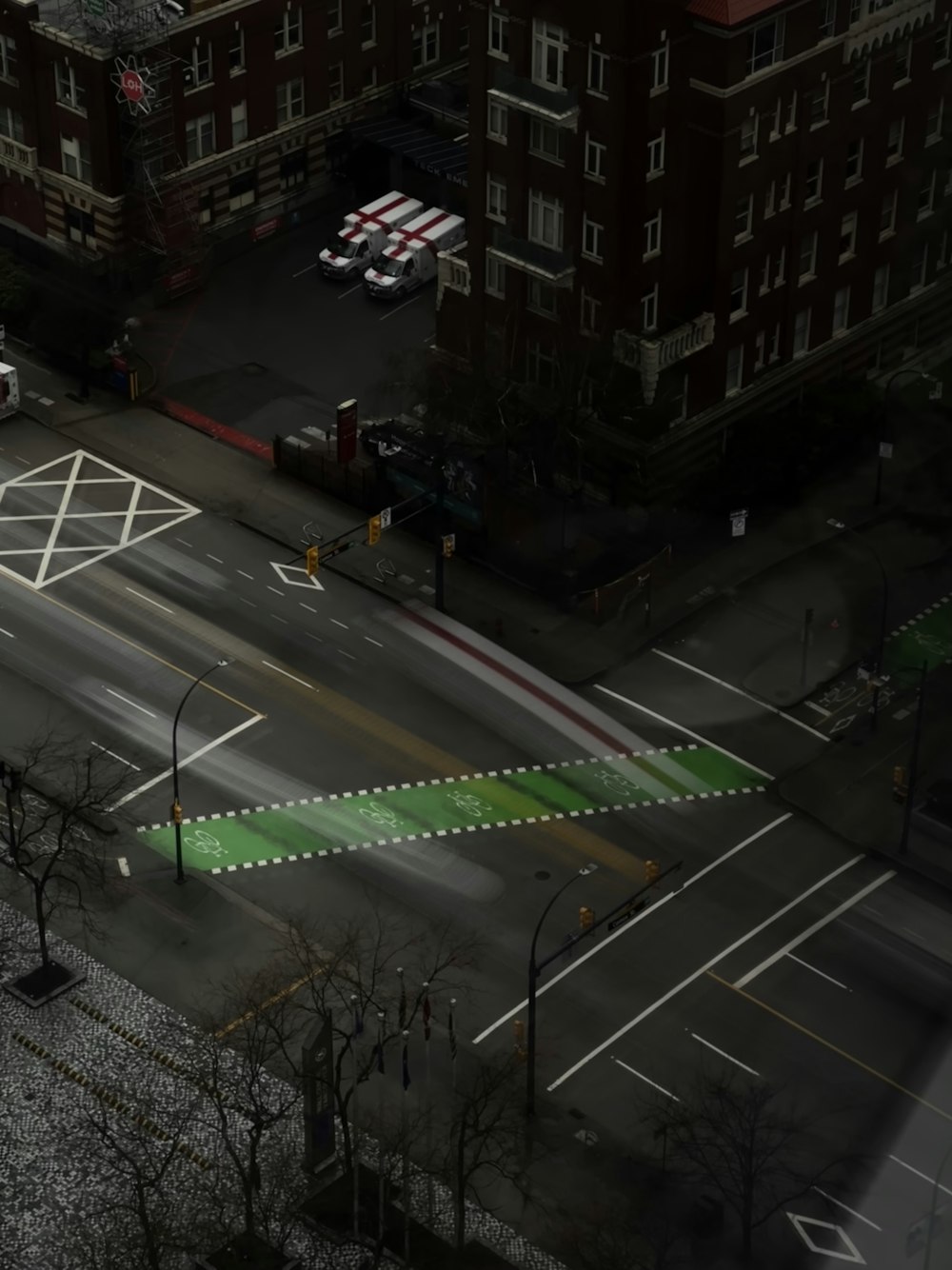 an overhead view of a city street with a crosswalk