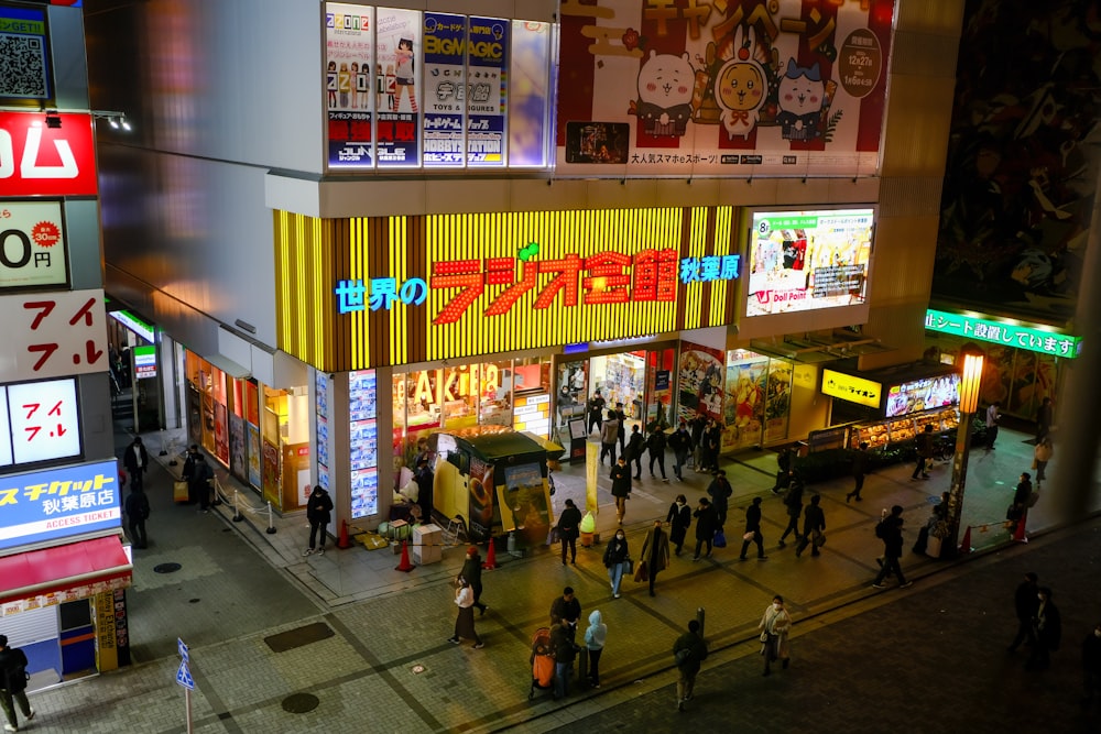 a group of people standing outside of a store