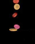 a group of buttons flying through the air