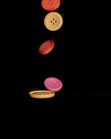 a group of buttons flying through the air