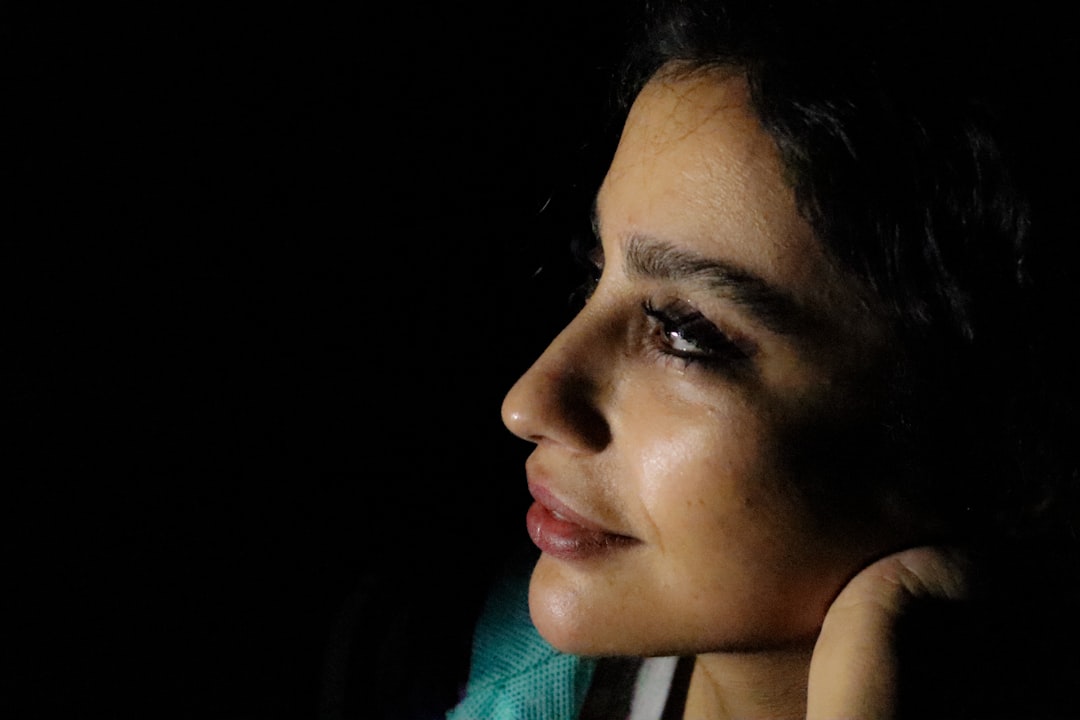 a close up of a person talking on a cell phone,