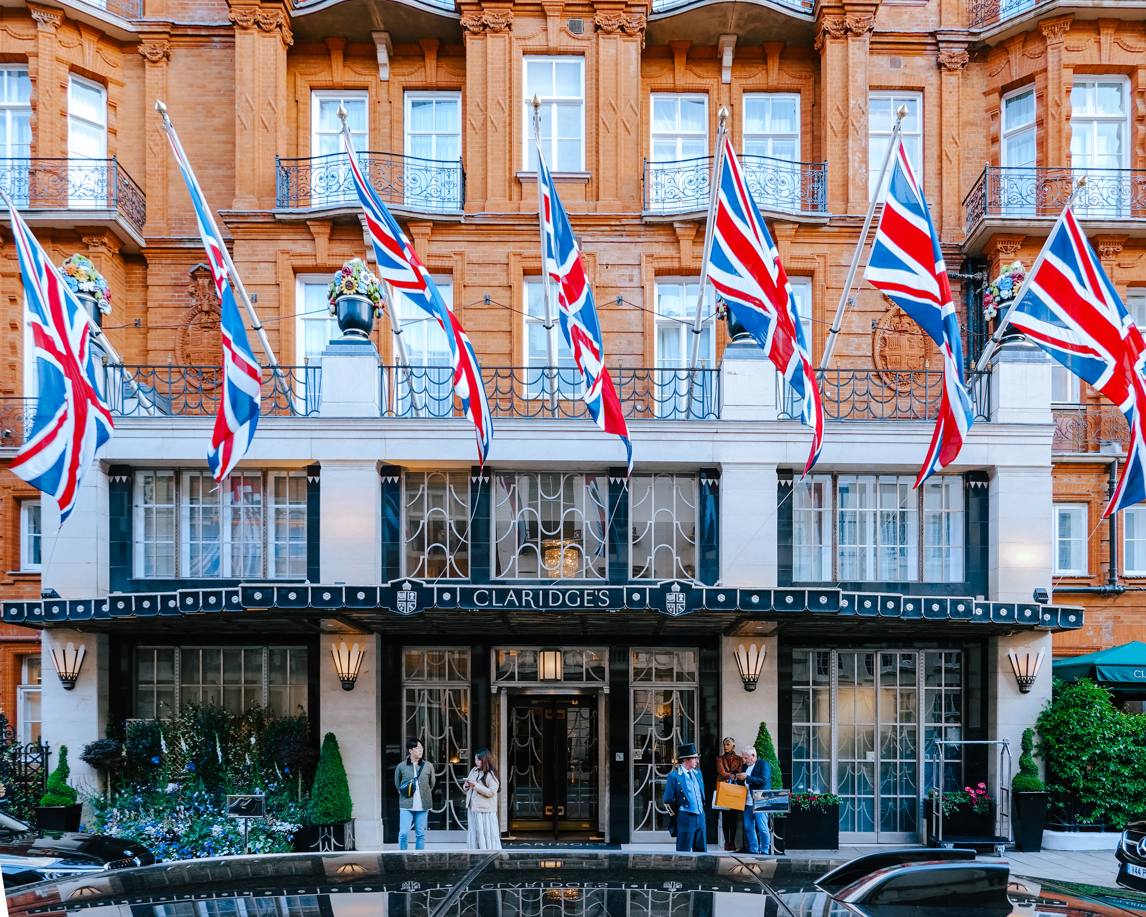 Union Jack flags above an elegant building on Brook Street, Mayfair