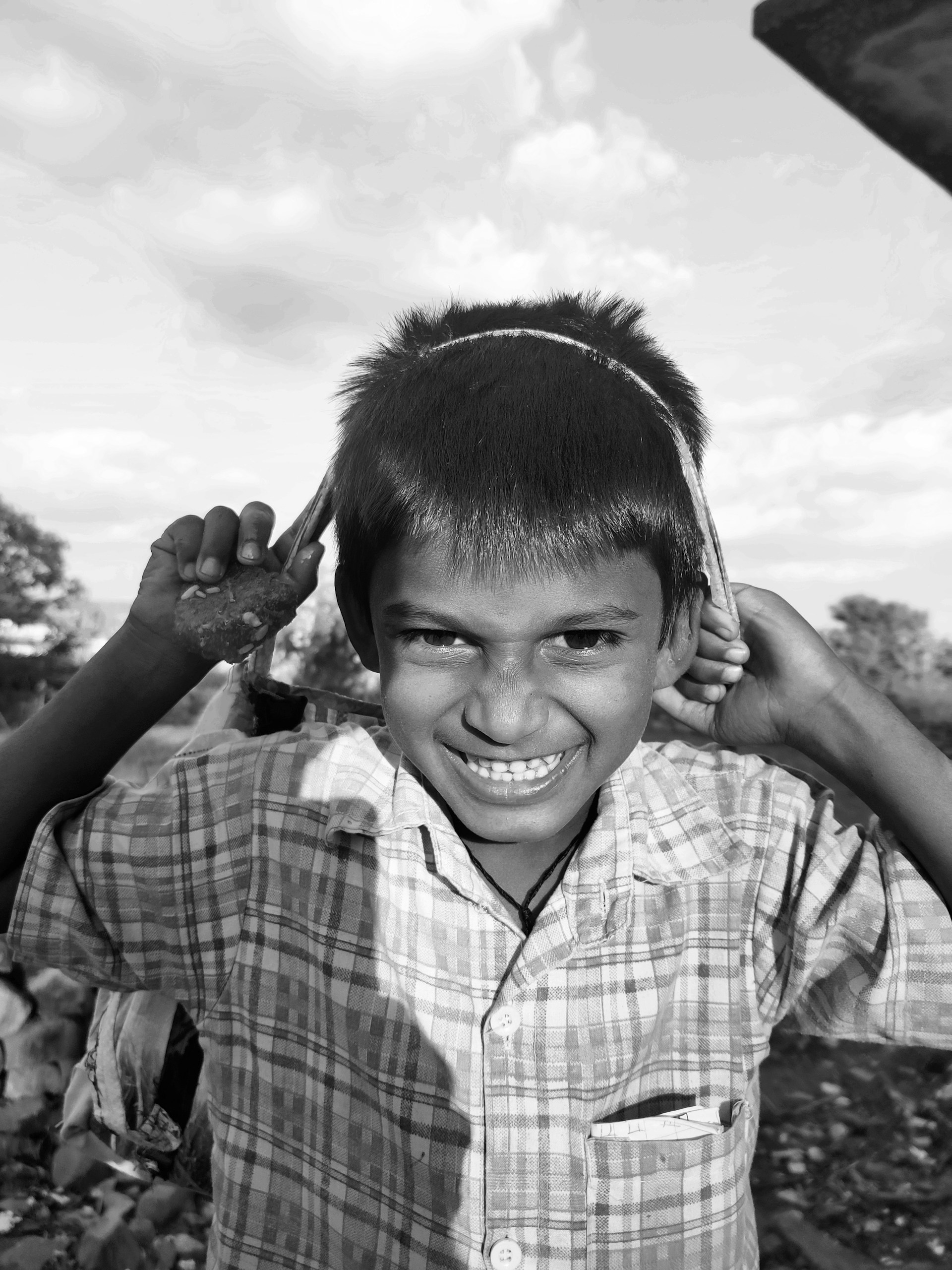 a black and white photo of a young boy