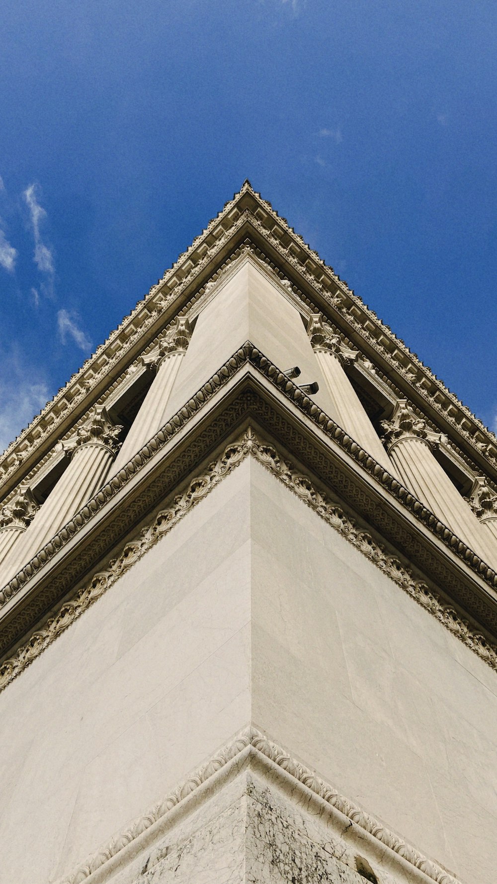 a tall building with a clock on the top of it