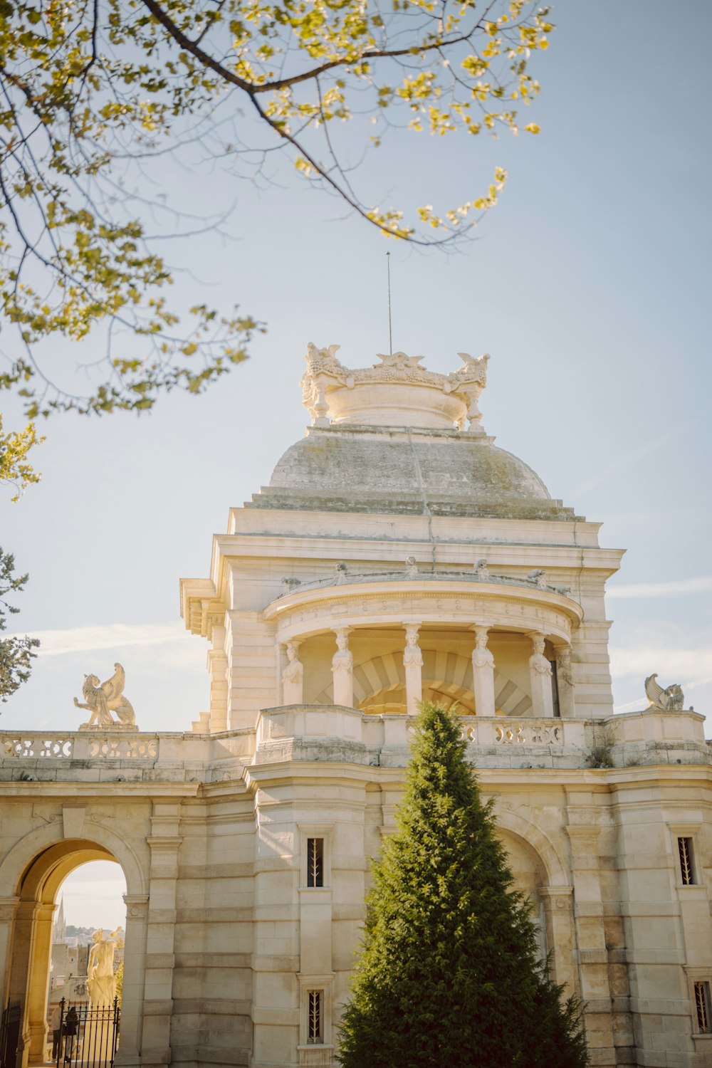 a large building with a tree in front of it