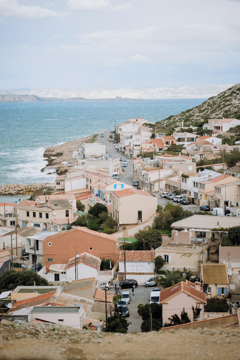 a view of a town by the ocean