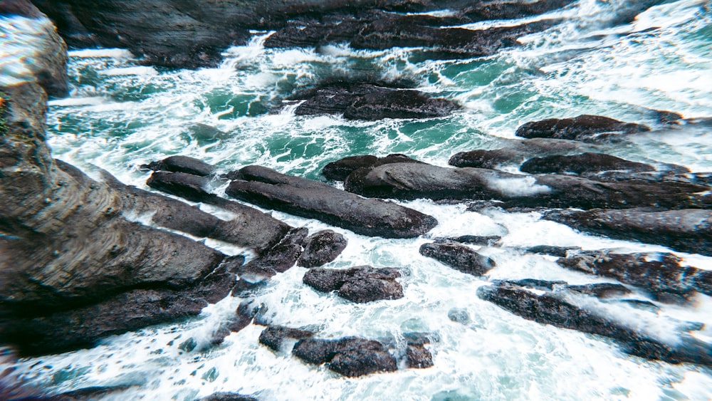 a bunch of rocks that are in the water