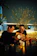 A smiling couple enjoying a rustic Mediterranean meal at Onda Antica's cozy wooden table.
