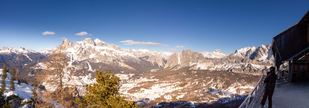 a view of a mountain range with snow on it