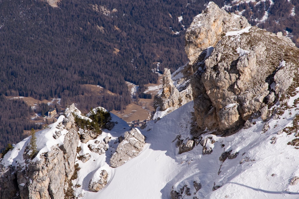 a snow covered mountain with a few rocks on top of it